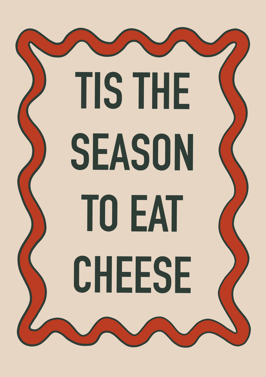 Funny Christmas print reading “’Tis the Season to Eat Cheese” in festive hand-written text.