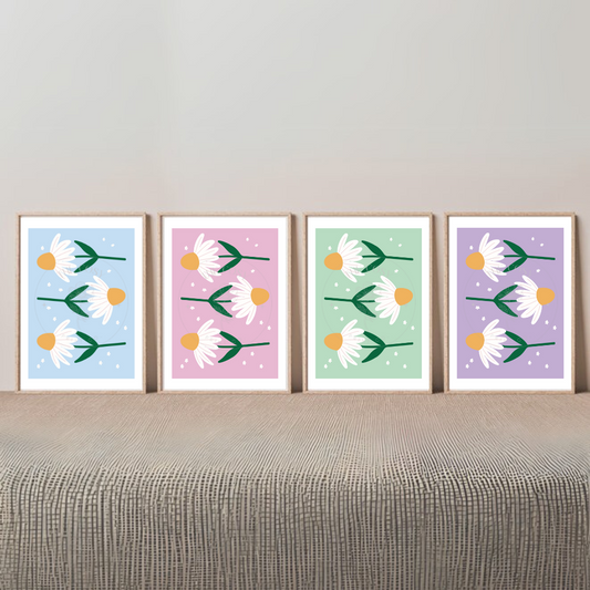 Set of 4 hand-drawn daisy prints in pastel pink, purple, blue, and green shown as a gallery wall.