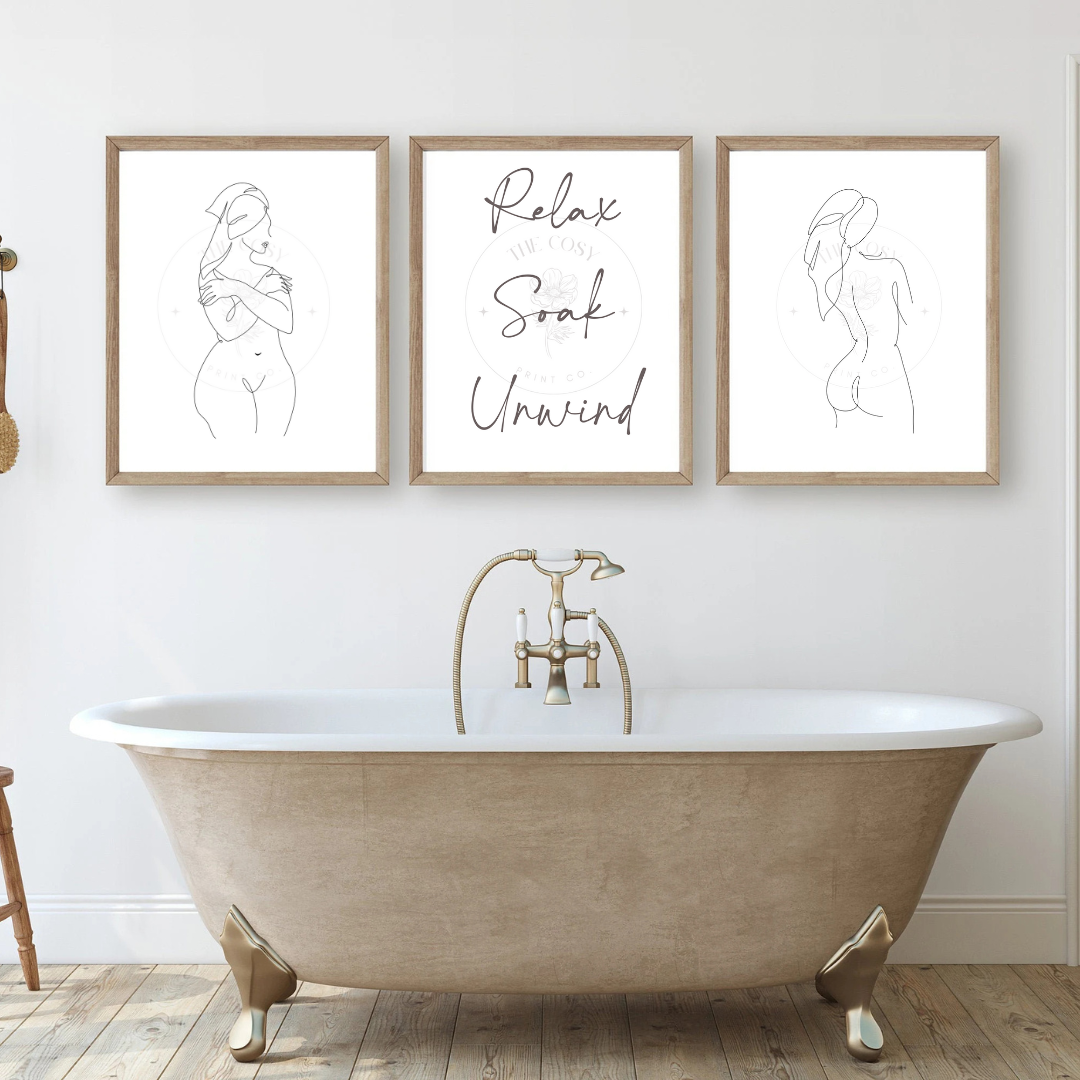 Trio of black and white line drawings featuring two women in towels and a central quote: "Relax. Soak. Unwind." – perfect for bathroom décor.