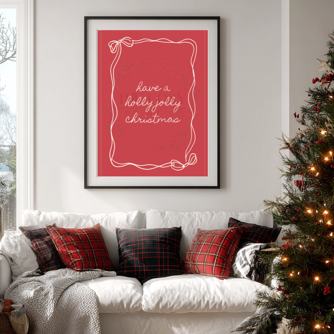 All-red Christmas print with hand-lettered text reading “Have a Holly Jolly Christmas” and a hand-drawn bow.