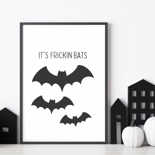 Black and white minimalist print featuring the Halloween quote “It’s Fricken Bats” – hand-drawn wall art by The Cosy Print Company printed on 200gsm Colour-Lock™ paper, available in A4 and A3 sizes.