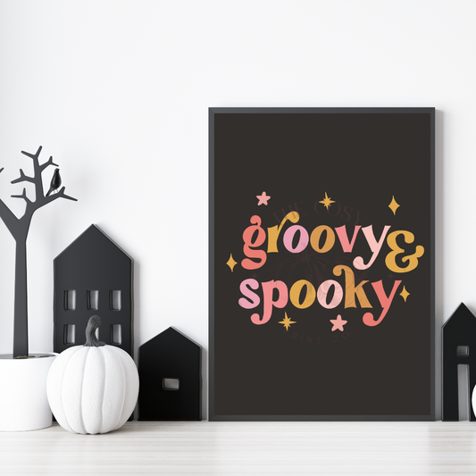 Black background Halloween wall art print featuring funky hand-drawn lettering reading “Groovy and Spooky” in bright colours – printed on 200gsm Colour-Lock™ paper, available in A4 and A3 sizes.