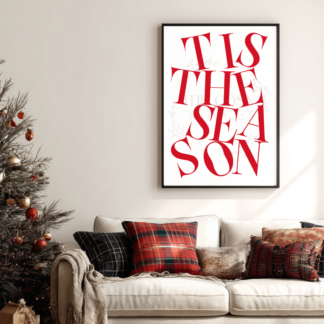 Christmas print with hand-lettered text reading “Tis The Season” in red and white.