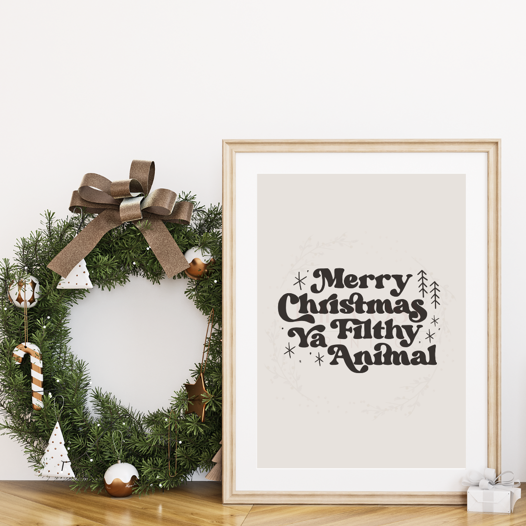 Cream Christmas print with bold black funky text reading “Merry Christmas Ya Filthy Animal.”