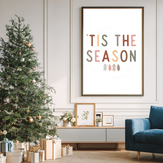 Minimal Christmas print with hand-lettered text reading “Tis The Season” on a neutral background.