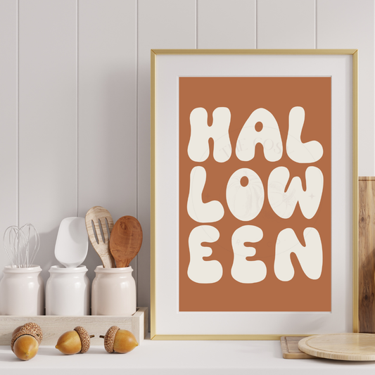 Minimal orange and cream wall art print with bold “HALLOWEEN” typography – hand-drawn seasonal decor by The Cosy Print Company, printed on 200gsm Colour-Lock™ paper, available in A4 and A3 sizes.
