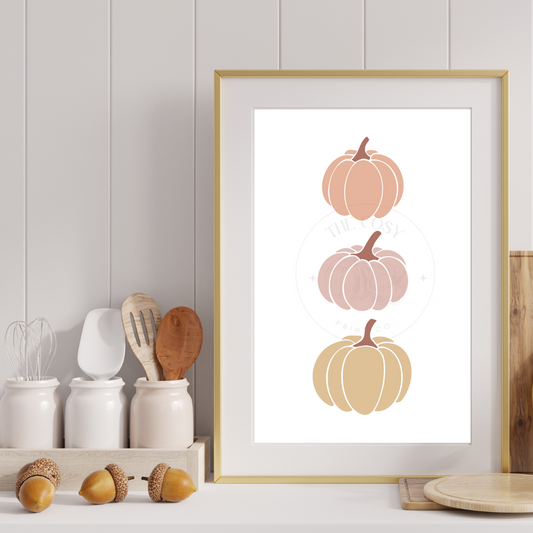 Minimalist three pumpkins print in soft neutral autumn colours – cream, beige, and brown wall art