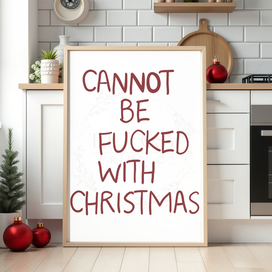 Red and white hand-written Christmas print with humorous festive text.